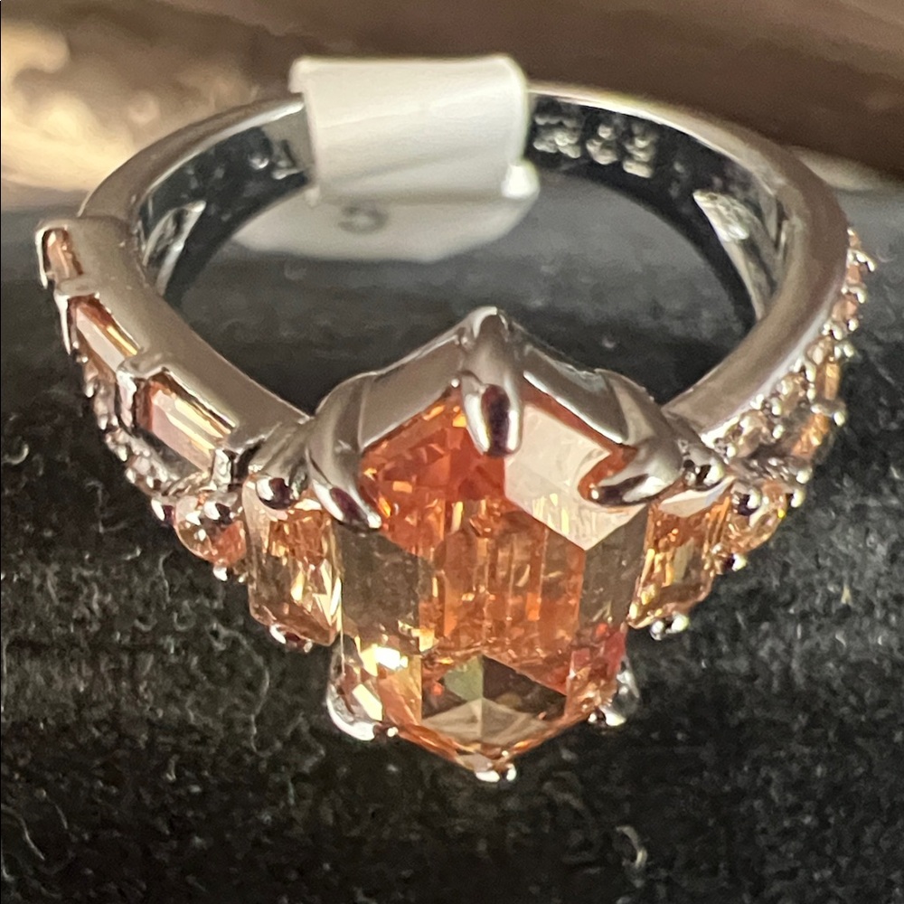Radiant Silver Ring With Orange Gemstone - image 2
